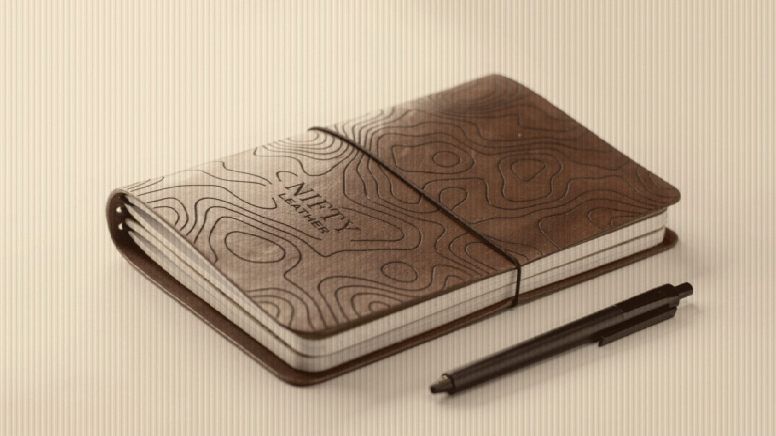 A notebook with a pen on top of it