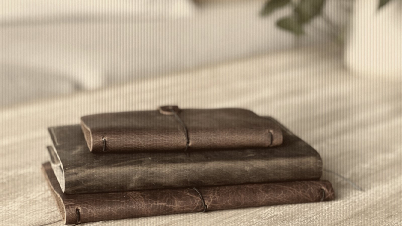 A couple of books sitting on top of a wooden table