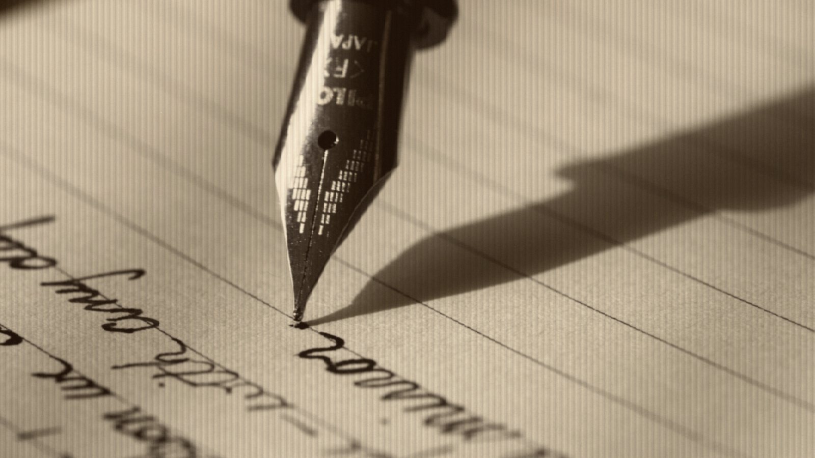 Fountain pen on black lined paper